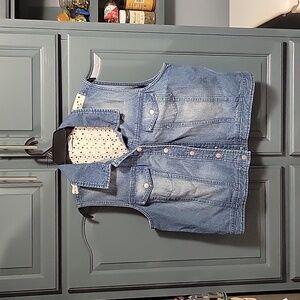 Like new denim and lace sleeveless jacket.  2 pockets on front